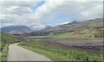 NG8341 : Minor road beside  northern arm of Loch Kishorn by Stuart Logan