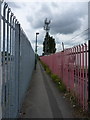 Telecoms mast and footpath in Spring Bank