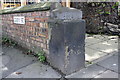 Benchmark on corner wall pier outside St Nicholas Arms