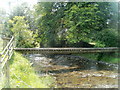 SN7132 : Wooden bridge across the Afon Dulais, Llanwrda by Jaggery