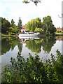 Luxury cruiser moored at a riverside garden at Bray