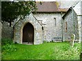 SU9013 : Porch and seat at  East Dean church by Shazz