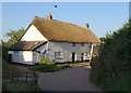 ST0215 : Thatched cottages, Whitnage by Derek Harper