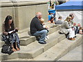 NZ2742 : Tourists in Market Place by rob bishop