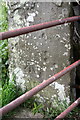 Benchmark on gatepost near entrance to Reedmere House