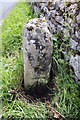 Benchmarked stone beside wall at Yoredale Cottages