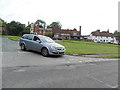 Silver car on Newick village green