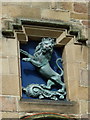 Bronze lion over the door of Tain Tollbooth