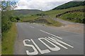 SK0598 : 'Slow' Sign on Road by Mick Garratt