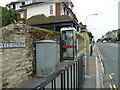 Approaching a phone box in West Street