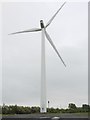 NZ2478 : Wind turbine, Windmill Industrial Estate by Andrew Curtis