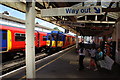 Trains passing at Earlsfield Station