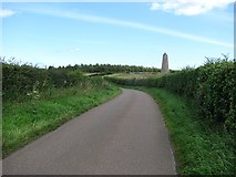NU1433 : Minor road by Spindlestone Ducket by Richard Webb