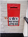 TM2460 : Post Office Mill Lane George V Postbox by Geographer