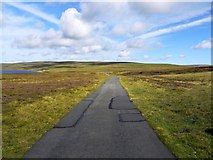 NY8129 : Road east of Cow Green Reservoir by Andrew Curtis