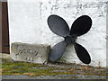 Ship screw on display outside maritime museum, Caernarfon