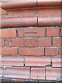 Benchmark at railway station, Llandudno