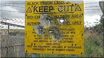 NS8990 : Shot up sign, Black Devon landfill site by Richard Webb
