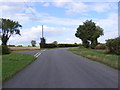 TM2256 : Road junction with the road to Chapel Road by Geographer