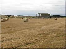 NT4876 : Barley bales and barn at Garleton by M J Richardson