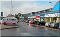 Pink and white VW camper van in parking area, Malpas Road shops, Newport