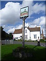 Egerton village sign and pub