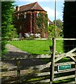 Colmans Farmhouse glimpsed from bridleway