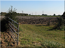 TL4861 : Ploughland and pylons by John Sutton