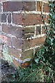 Benchmark on wall angle, High Street