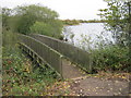 TF2303 : Footbridge for path around the northern side of the lake at Eye Green LNR by peter robinson