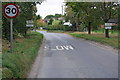 A parish boundary along the middle of Moreton Road