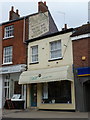 Bridport: hairdresser?s and old painted advert, East Street