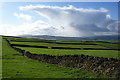 Walls and green fields and a shower out of the blue