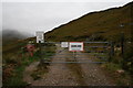 NM9891 : Gate at end of public road, by Strathan by Peter Bond