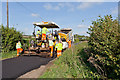 Laying a new surface course in Hensting Lane