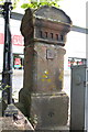 Benchmark on gatepost at Sands Centre carpark entrance