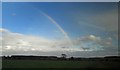 NU1926 : Rainbow over farmland from an East Coast train by Steve  Fareham