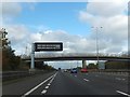 SO8941 : Motorway information sign and bridleway bridge north of Strensham Services by David Smith