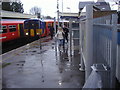 Train arrival in storm at Strawberry Hill station