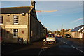 The Three Wheat Heads and the road through Thropton