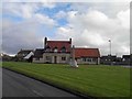 Westerleigh war memorial and in the background the New Inn