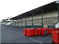 A stand and many red wheelie bins, Chepstow Racecourse