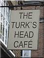 TQ3480 : Sign for The Turk's Head Café, Tench Street / Green Bank, E1 by Mike Quinn