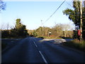 TM2481 : B1116 Harleston Road crossroads & Heath House Postbox by Geographer