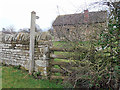 SO4477 : Signpost, stile and barn at Duxmoor by Row17
