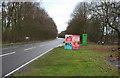 The A614 looking North with signs by the Clumber Park hotel