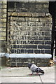 Benchmark on gatepost at entrance to St James Gardens