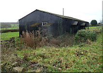 ST6892 : Derelict corrugated metal building, Whitfield by Jaggery