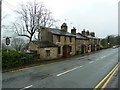 Row of terraced houses on Mossley Road, Grasscroft