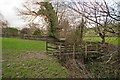 A footbridge on Coney Gut at Coombe Farm as seen from downstream